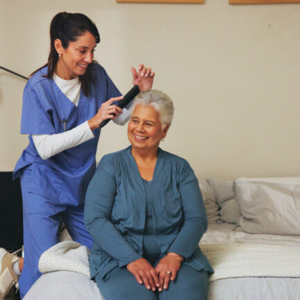 Nurse, brush and senior patient with hairstyle for self care, grooming or morning routine at assist.